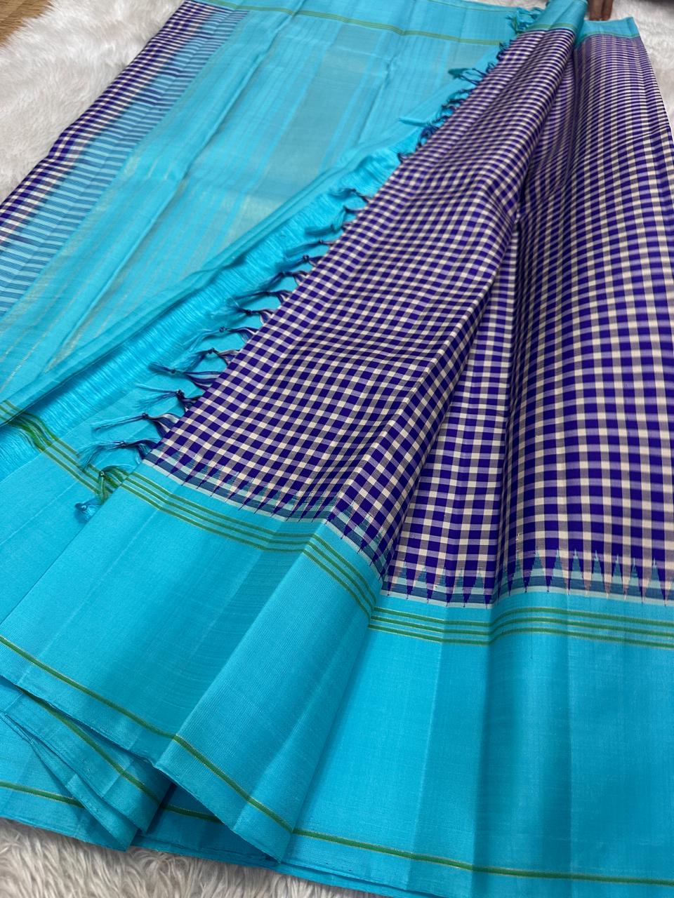 “Nirai – purple” Heritage Podi Kattam Checks in Kanchipuram Silk
Fine Madras-Style Geometry in Purple & Ivory
Sky Blue Border with Subtle Zari Accents
Crafted in the Finest Pure Silk
A Checkered Drape of Culture & Grace