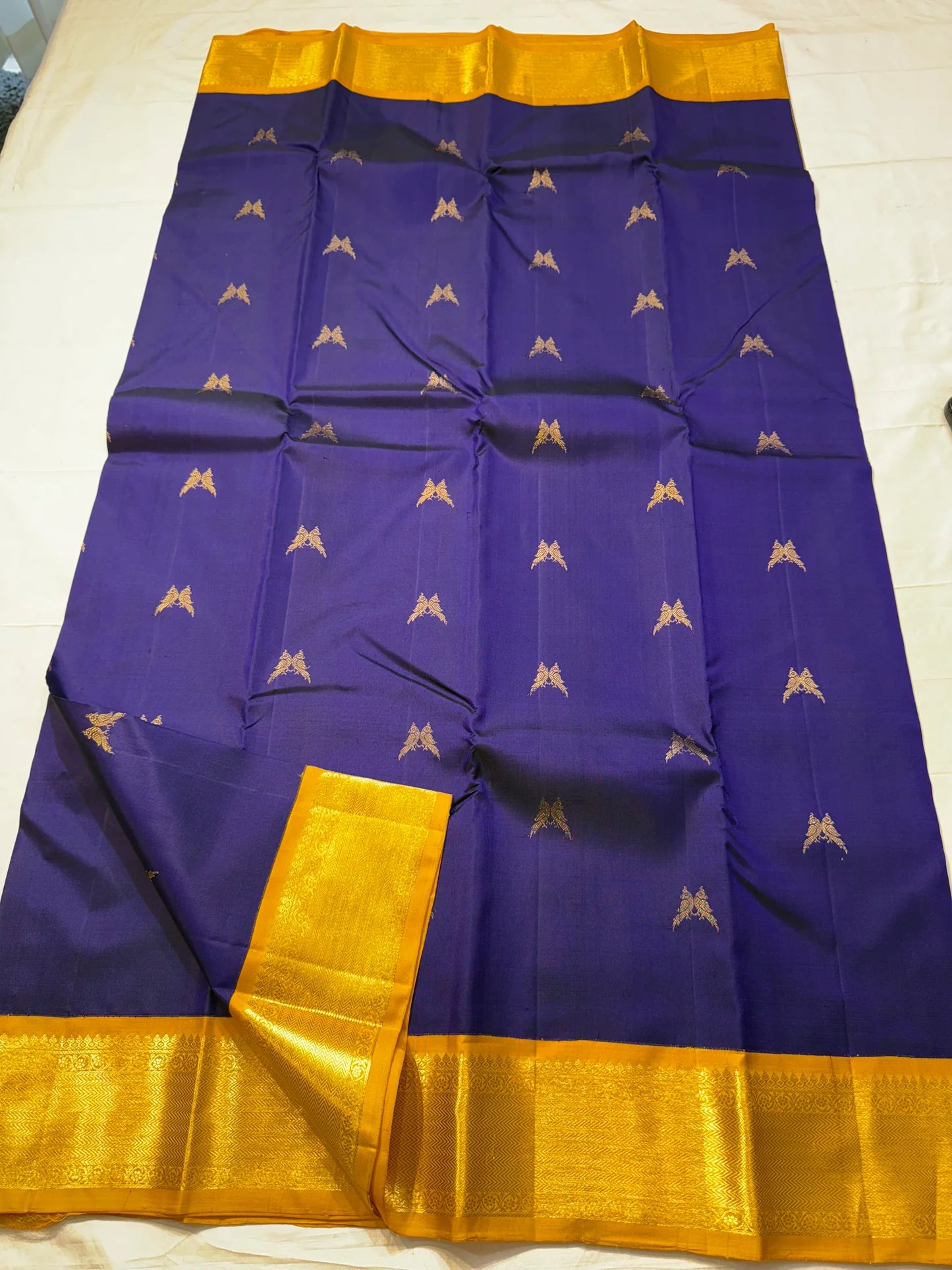 Iru Pakshi Purple — Pure Silk Kanchipuram Saree
Royal Purple with Twin-Bird Zari Buttas & Marigold Mustard Korvai Borders ✨
Silk Mark Certified ✅ | Ships in Two Weeks | Free Shipping within 🇺🇸