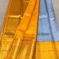 Eesha – Grey-Blue & Mustard Kanchipuram Pure Silk Saree.
Zari Butta All Over with Hamsa / Annapakshi   Motifs in Arai Maadam border . 
Detailed Chevron in pure 3g Zari Pallu with Muthu Seer Border for a Timeless Drape