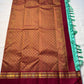 Neer Pachai Vairaoosi — Kanchipuram Pure Silk saree 

Sea-foam/aqua body with classic Vairaoosi pinstripes

Contrast ruby-maroon korvai borders with gold chakram & floral panels

Grand maroon pallu with all-over chakram jaal and paisley vines; aqua tassel