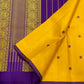 Manjal Vadamalli Chakram – Pure Kanchipuram Silk Saree

Marigold yellow body with purple floral thread buttas

Grand royal purple pallu with gold medallion zari & reku-style stripes

Handwoven Double Warp Weave | Silk Mark Certified | Fall & Pico Done