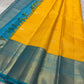 This radiant yellow pure silk drape is elevated by an exquisite and unexpected pairing — a serene sky blue border, making it both eye-catching and rare. Fine zari checks shimmer gently across the body, timeless bavaanji border