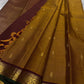 Amber Oosikattam ✨ – Pure Kanchipuram Silk Saree
Burnished Amber-Gold Body in Oosi Zari Kattam with Leaf Buttas
Deep Maroon Korvai Border with Green Selvedge & Elephant Motifs
Regal Maroon Pallu with Intricate Gold Zari Brocade
Silk Mark Certified |