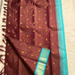 Rathi – Earthy Brown Vairaoosi Silk Saree with Petite Kamalam & Chakram Buttas, featuring a finely Woven Muthu Seer Zari Border in a Classic Style
Pallu in Soothing Rama Blue with Grid-Like Zari Motifs of Paisley & Chakram