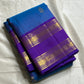 Azure Blue Purple Horizon – Neelam blue body with royal-purple korvai borders  Pure Kanchipuram silk • manga (paisley) buttas + fine pin-stripes  Opulent purple brocade pallu • contrast blouse with zari border  Silk Mark Certified | Fall & Pico Done |