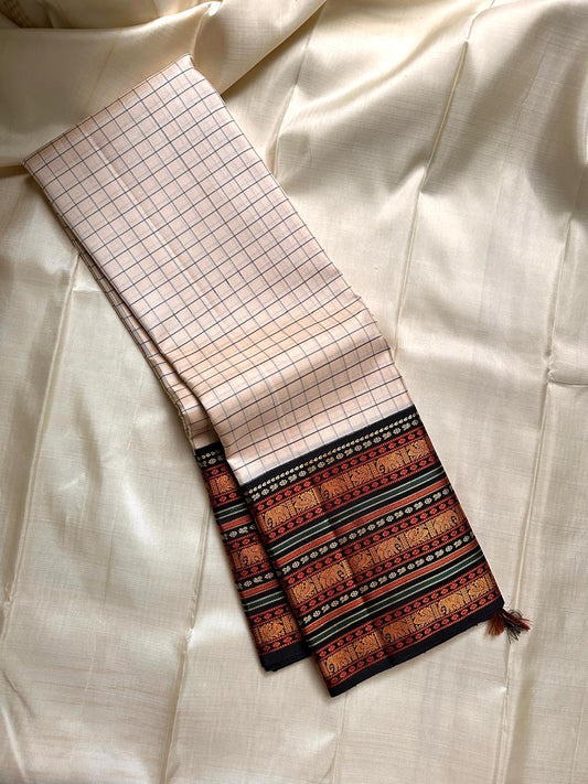 Ivory Varisaipet – Pure Kanchipuram Silk Saree
Pattunool Kattam Checks on Ivory Base
Black Borders with Elephant & Floral Motifs
Antique Gold, Rust & Bottle-Green Stripes

Silk Mark Certified, delivery in 2 weeks