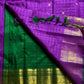 Sunanda – Royal Purple Pure Kanchipuram Silk Saree with Zari Checked Buttas & Majestic Sorgavaasal Mayil Peacock Medallion Temple Border