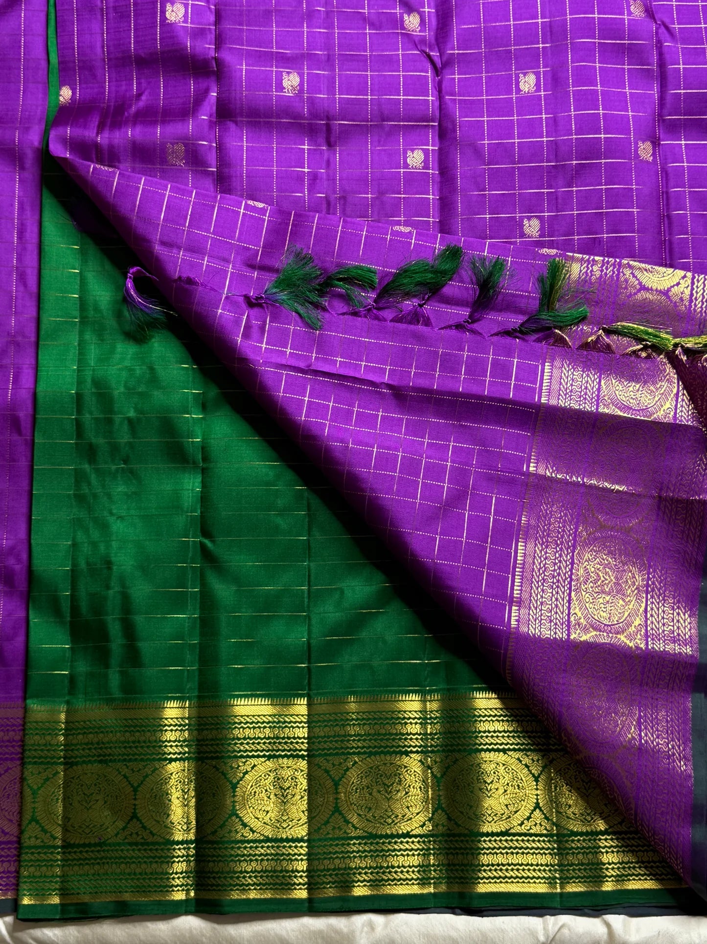 Sunanda – Royal Purple Pure Kanchipuram Silk Saree with Zari Checked Buttas & Majestic Sorgavaasal Mayil Peacock Medallion Temple Border