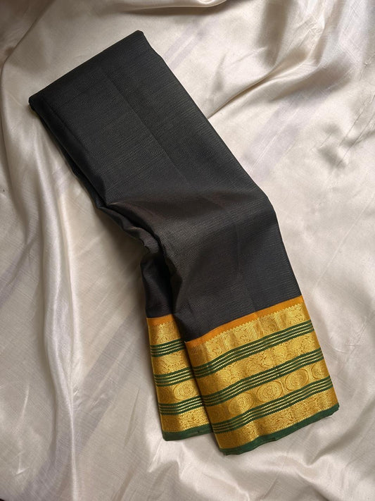 Adar Manjal Chakram – Pure Kanchipuram Silk Saree
Deep green  & Manjal-Gold Zari Korvai Borders 
Chakram & Floral Zari Motifs, Grand Manjal Brocade Pallu
Silk Mark | Fall & Pico Done | Blouse Stitching Available | ships in  2 weeks