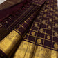 Full pallu view of plum Kanchipuram silk saree with dense gold zari weaving and bold elephant motif border.