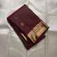Zari Kattam Araimaadam – Coffee Brown, Pure Kanchipuram Silk Saree
Coffee-brown body with zari kattam checks, floral & mango buttas
Grand antique-gold border with floral/peacock vine;
Silk Mark Certified | Blouse Piece Included |ships in 1 week