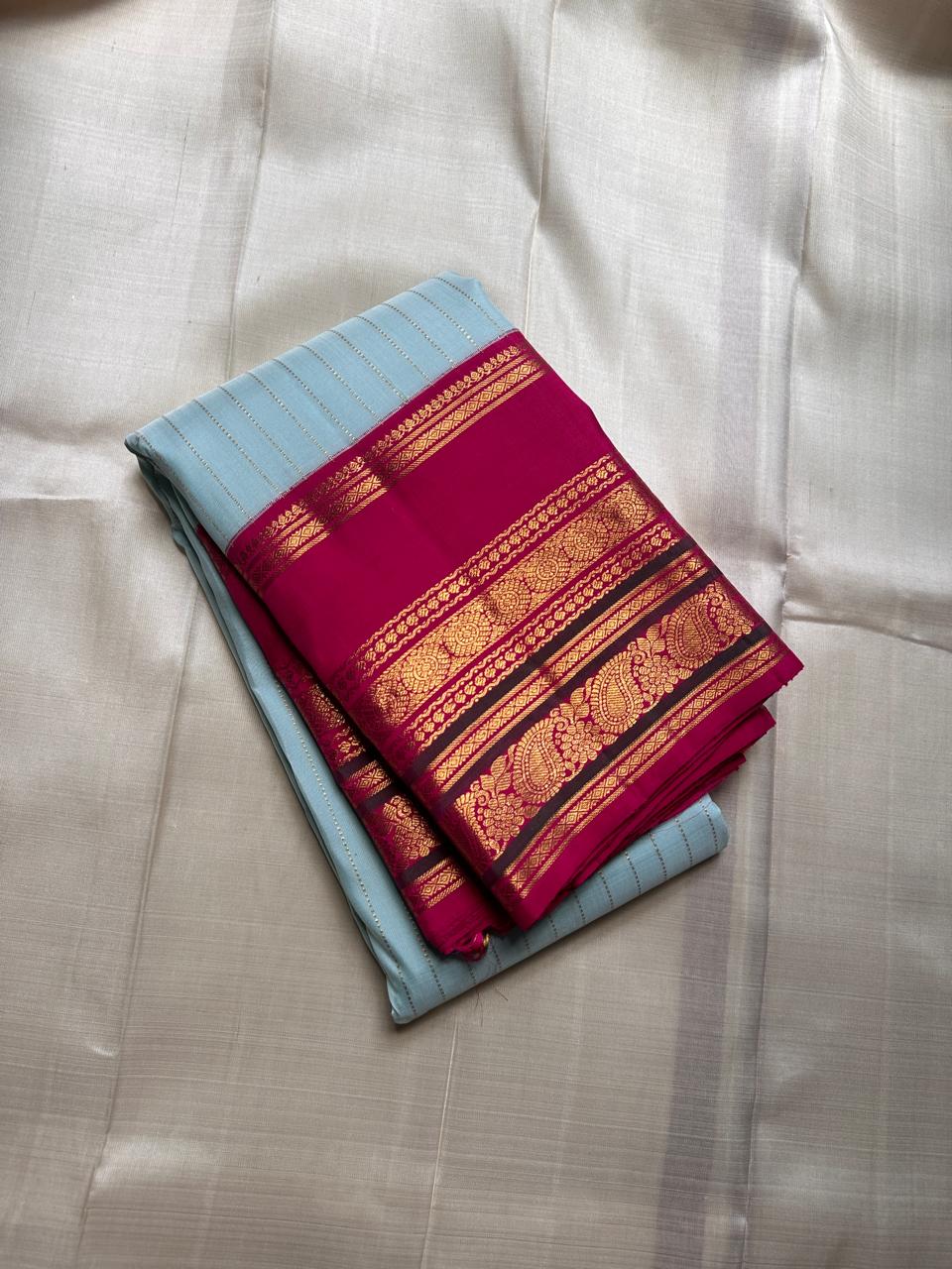 Orchid Sky ✨ – Pure Kanchipuram Silk Saree in Sky-Blue with Vertical Zari Stripes
Korvai Contrast Magenta Varisaipet Border & Grand Gold Zari Pallu
Contrast Magenta Blouse Piece with Matching Zari Border Attached
Silk Mark Certified | Fall & Pico Done |