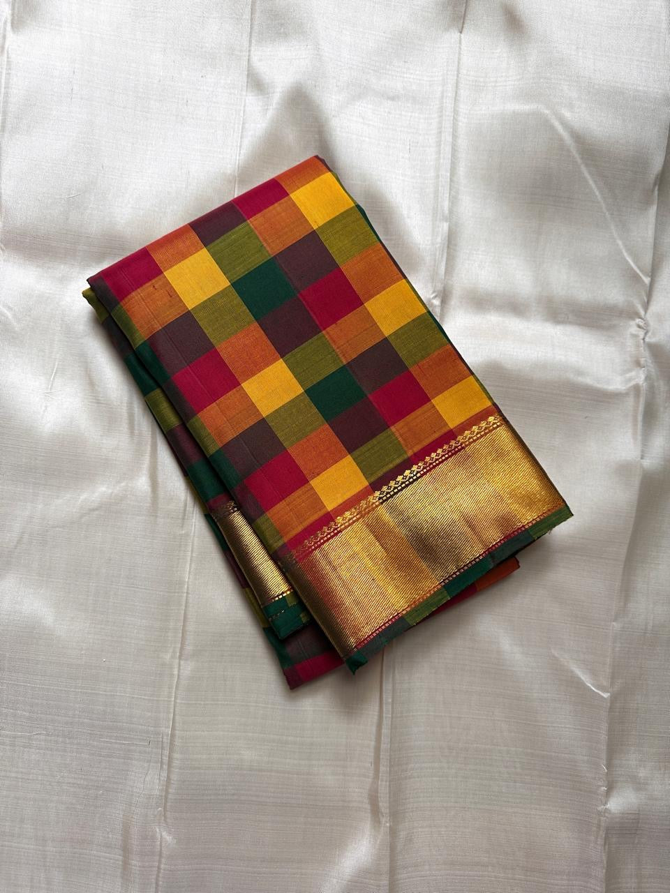 Paalum Pazhamum multicolor kattam silk saree fold with broad gold zari border and green edge