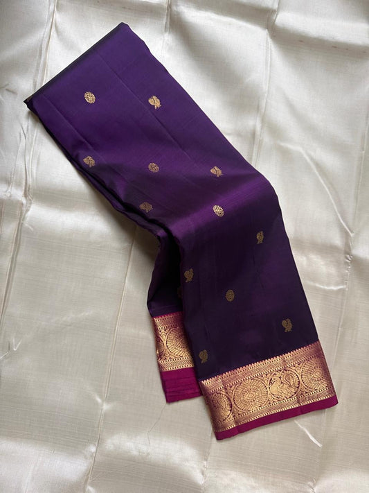 Berry Ruby Kamalam Butta — Pure Kanchipuram Silk
Lotus zari buttas on deep ruby silk with rani korvai border
Silk Mark Certified • Free Shipping within USA • Ships in Two Weeks