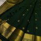 Agnika – Green Kanchipuram Silk Saree with Mayil Chakram Butta
Fiery and regal, Agnika features a rich green silk body with intricate Mayil Chakram (peacock) motifs and a shimmering zari border—an elegant ode to South Indian tradition.
