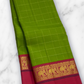 Valli Pachai – Kanchipuram Pure Silk Saree

Parrot-green body in kattam (grid) checks with subtle zari lines

Korvai contrast rani-pink borders featuring gaja (elephant) procession & temple reku motifs

Rich rani-pink zari pallu with vertical bands