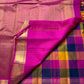 Navaranga Kattam — Multi-Color Paalum pazhamum checks  Kanchipuram Pure Silk

Rani-magenta contrast border & rich zari pallū 

Gold coin & peacock buttas over jewel-tone squares

Handloom Kanchipuram • Matching magenta blouse with borders