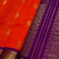 An exquisite blend of tradition and vibrancy, this silk cotton saree features a radiant orange body adorned with elegant gold zari buttas, The rich contrast border and pallu in royal purple and intricately woven with traditional gold zari motif