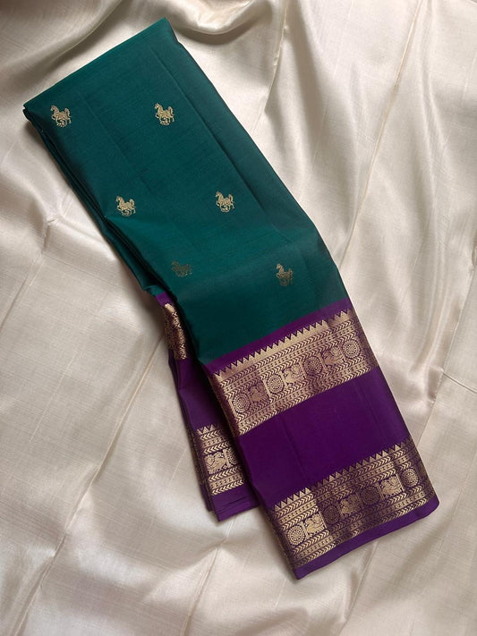 A very unusual horse motif on pure silk Kanchipuram saree, deep green with purple Vanasingaram border 💜