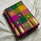 Pallavi – Kanchipuram Paalum pazhamum checks/ Zari kattam  Silk Saree in Turmeric, Mango, Leaf Green & Beetroot Pink Checks.
Finished with a vibrant magenta border and rich gold zari pallu.