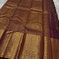 Varnika – Handwoven Kanchipuram Silk Saree in Plum Wine
A regal plum Kanchipuram silk saree adorned with gold zari paisleys and Gandaberunda motifs