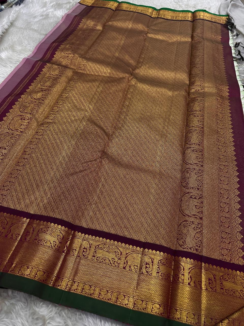 Pistachio Mist ✨ – Pastel Pistachio Vairaoosi Kanchipuram Pure Silk Saree
Korvai Wine-Maroon Border with Elephant Procession Zari Panel & Green Selvedge
Grand Gold Zari Pallu with Chevron & Silk Mark Certified | Fall & Pico Done | Blouse Stitching ($30) |