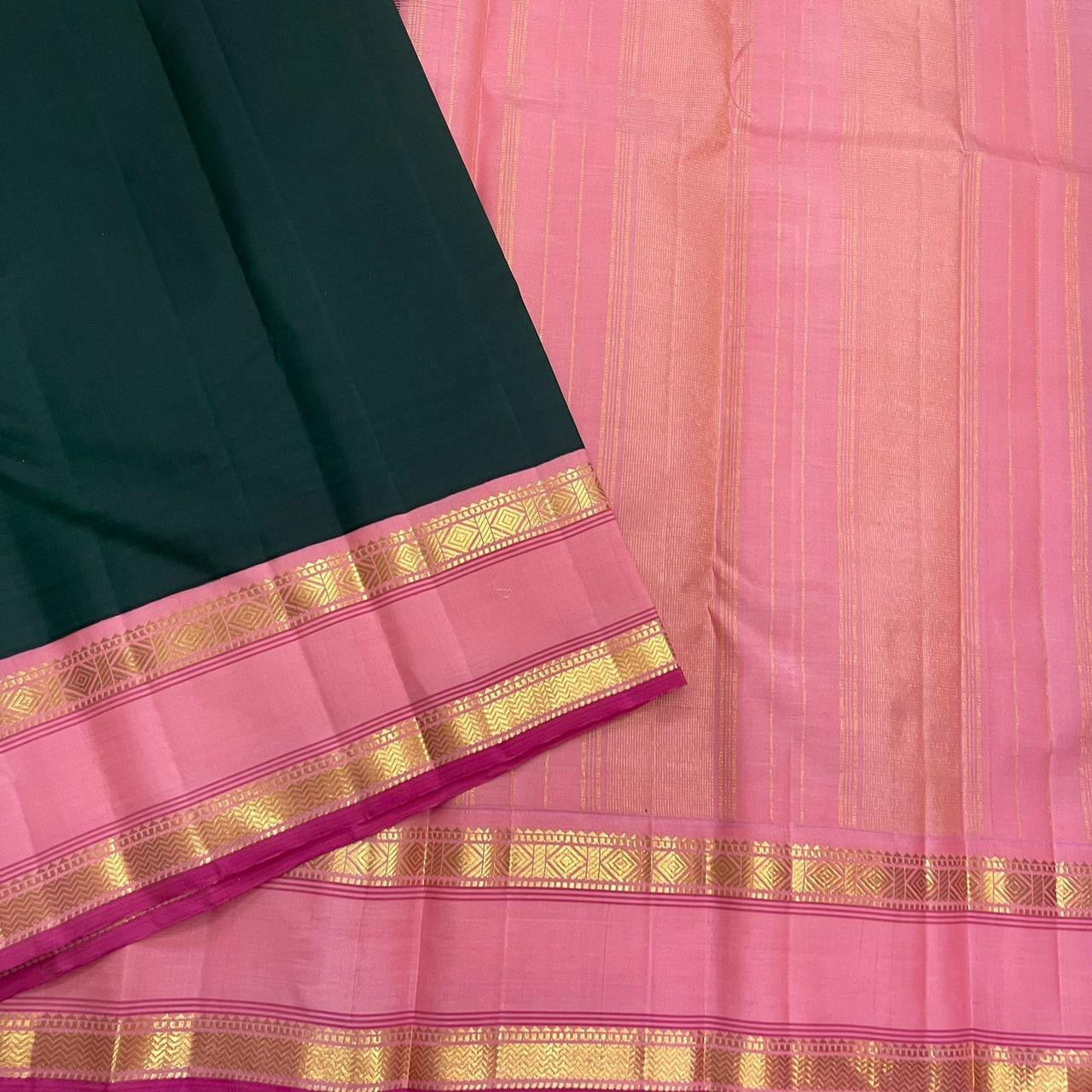 Pink pallu section with fine gold zari striping beside green silk body and rettapet border detail