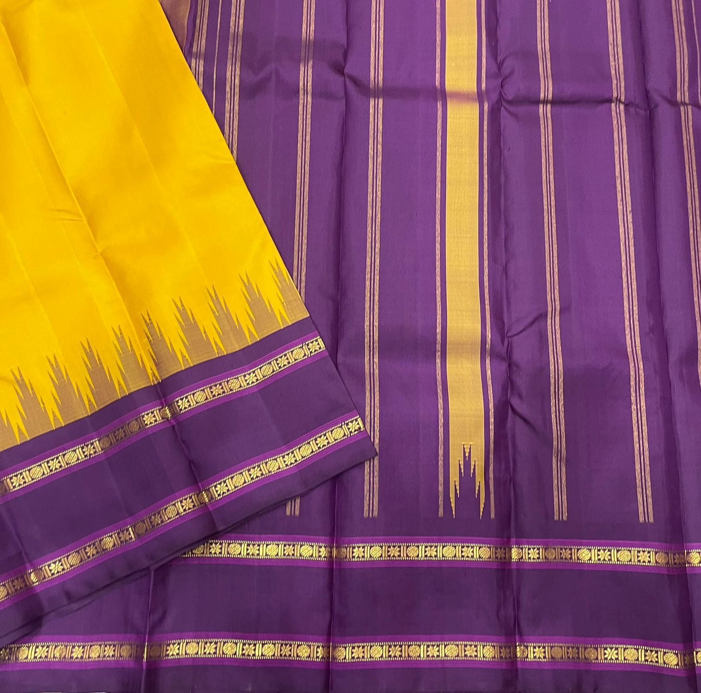 Suvarna Nitya
Mustard–Purple Kanchipuram Silk Saree
Heritage Temple Reku • Gold Zari Borders • Silk Mark Certified