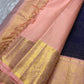 Deep navy blue Zari kattam with pink peach border peacock motif and Pallu