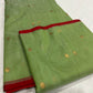 Green Chanderi Katan Silk saree showing translucent handloom body, red edging and zari pallu