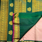 Full body view of petal pink pure silk Kanchipuram saree with Gandaberunda zari buttas