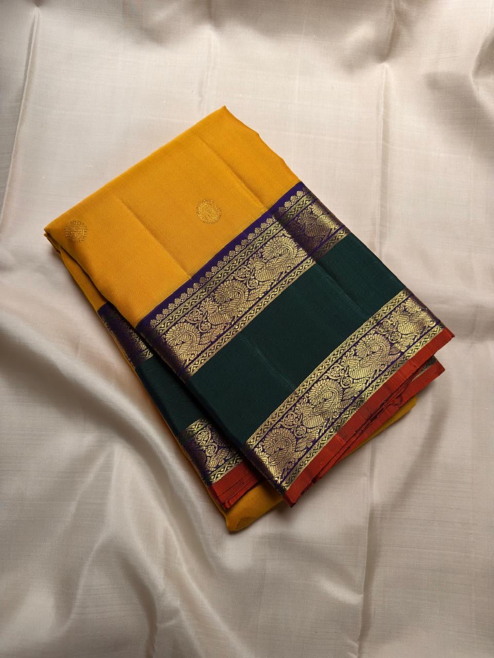 Emerald green Rettapet border with Mayil gold zari motifs