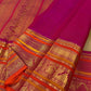 Muted olive green pure mulberry silk Kanjeevaram saree with traditional gold zari buttas.