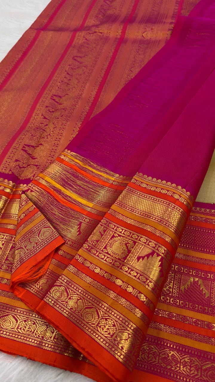 Muted olive green pure mulberry silk Kanjeevaram saree with traditional gold zari buttas.