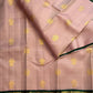 Rich emerald green pallu with twin-bird Gandaberunda zari motifs on a handwoven Kanchipuram saree