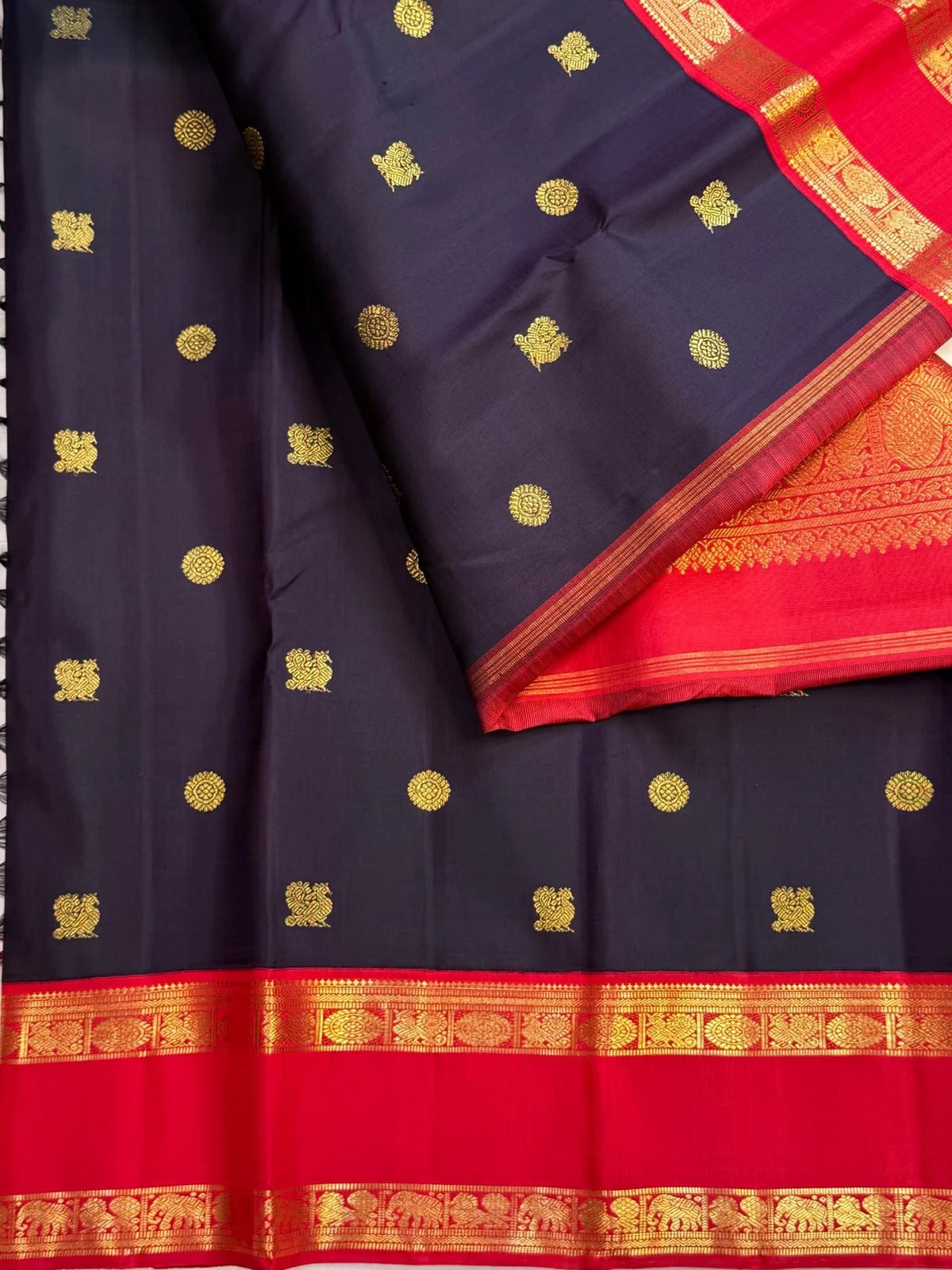 Vintage Kanjivaram saree in saturated deep violet with traditional zari buttas