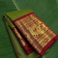 Pure Kanchipuram Korvai silk saree in olive moss green with vermilion red border and Gandaberunda zari