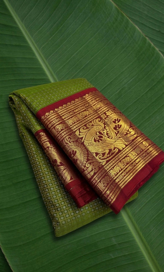 Pure Kanchipuram Korvai silk saree in olive moss green with vermilion red border and Gandaberunda zari