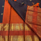 Folded view of dark charcoal and rustic cinnamon red rettapet Kancheepuram silk saree — Idam Living