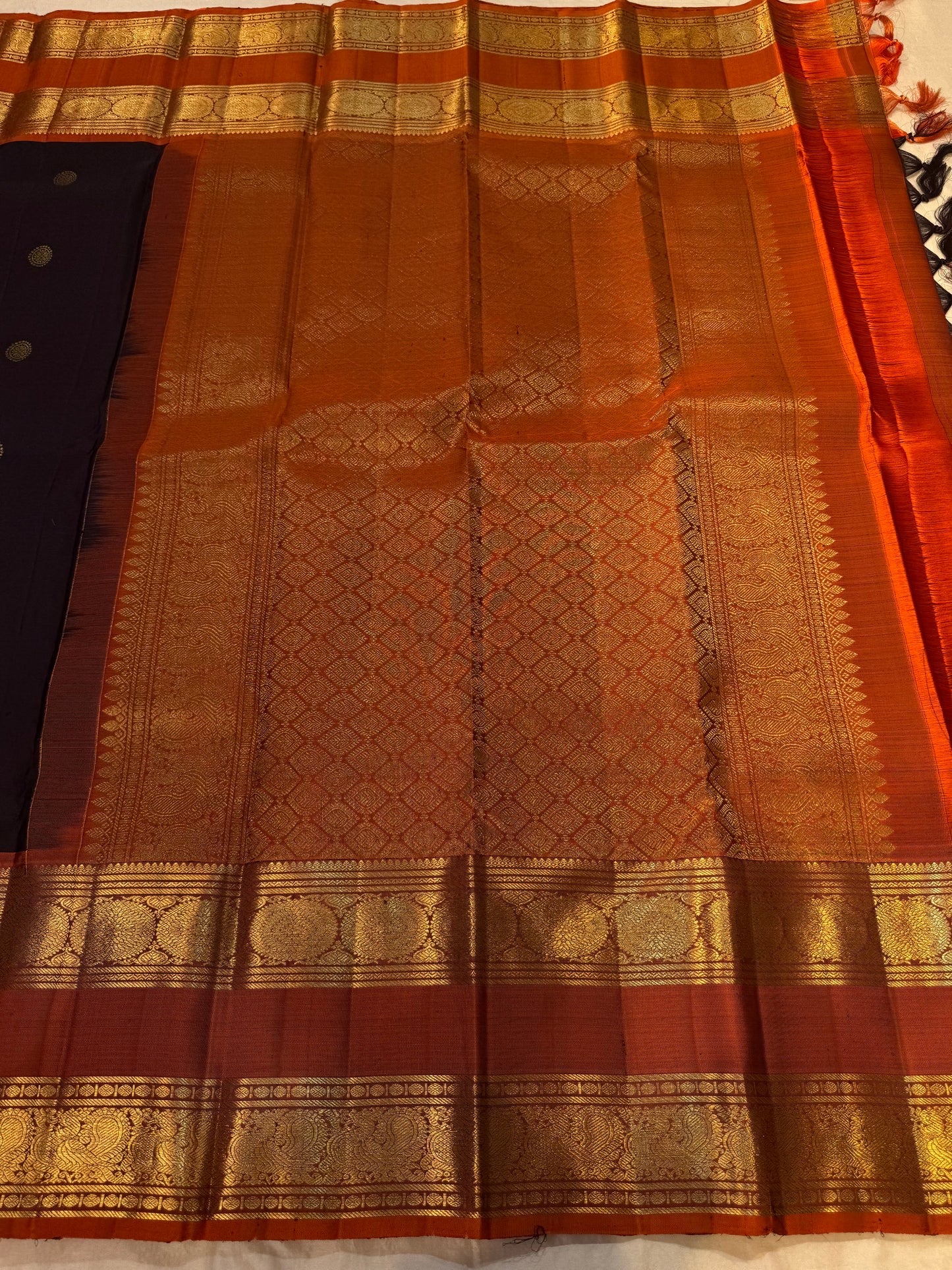 Dark charcoal pure silk Kancheepuram saree with cinnamon red rettapet border and gold zari pallu — Idam Living