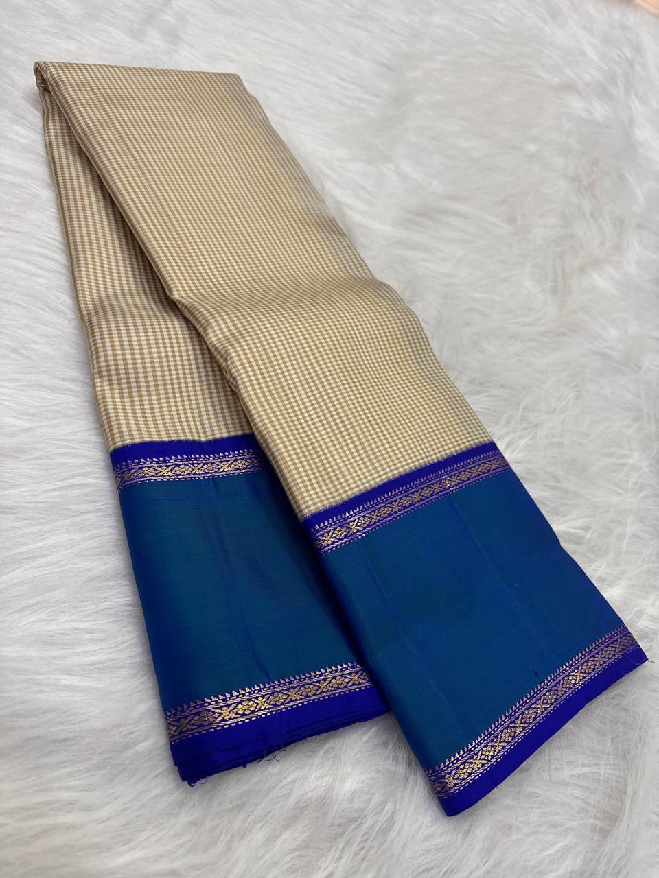 Ivory and Peacock Blue Handwoven Pure Silk Kanchipuram Saree with Kanchi Kattam Body and Rettapet Border