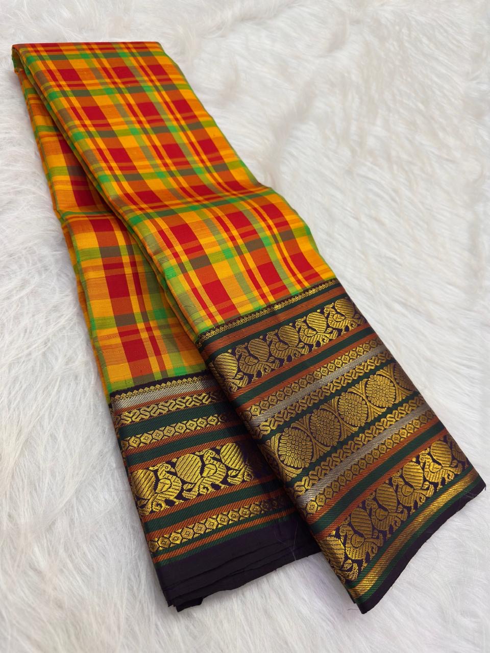 Handwoven Kancheepuram Varisaipet saree in multicolour silk checks with forest green Mayil Butta gold zari border, full folded view