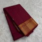 Folded view of the handwoven arakku red and bottle green Kanchi Pattu lightweight Korvai silk saree