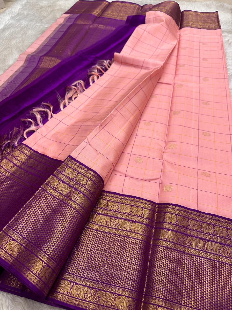 Close-up of radiant pink silk body with fine gold Zari Kattam grid and Kamalam Butta — Kancheepuram saree