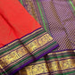 Handwoven Kancheepuram Butta saree in deep red with all-over dense gold zari butta and deep purple green Mayil Yazhi Butta border, full folded view