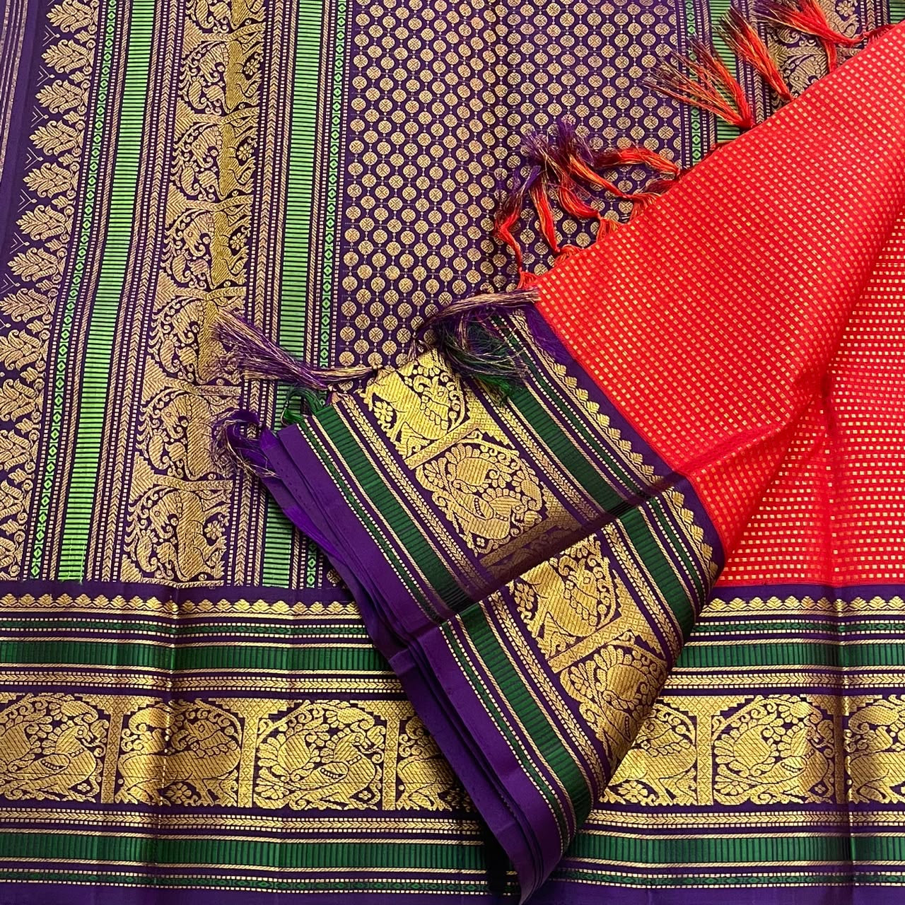 Antique gold Mayil and Yazhi figural pallu on purple-green silk thread ground — Kancheepuram Butta saree