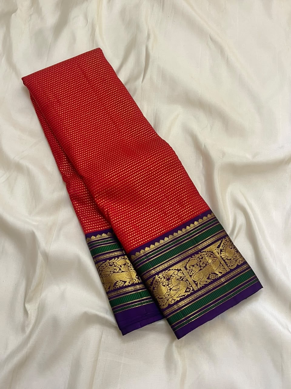 All-over dense fine gold zari butta diagonal pattern on deep red silk — Kancheepuram Butta body close-up