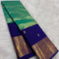 Folded view of the handwoven mint green and royal blue Kancheepuram tissue silk Korvai saree showing body shimmer and gold border