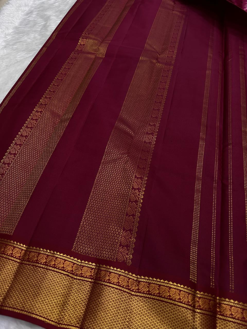 Handwoven pure silk Kanchi Pattu lightweight saree in arakku red and bottle green, Korvai construction with Kamalam Butta body and Varisaipet border — Idam Living