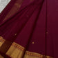 Pallu of the Kanchi Pattu lightweight saree in bottle green with Varisaipet gold zari banding